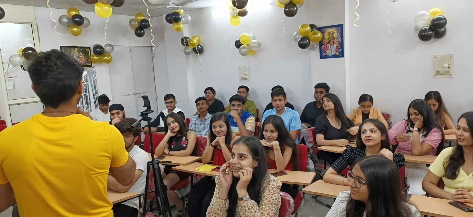 Teacher mentoring students during a class at Lotus Circle
